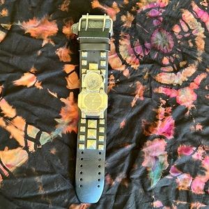 Leather studded flip top watch.